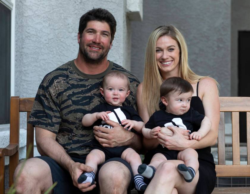 Shannon and David Belford pose for a portrait with their 9-month-old twin sons, Gavin and Garre ...