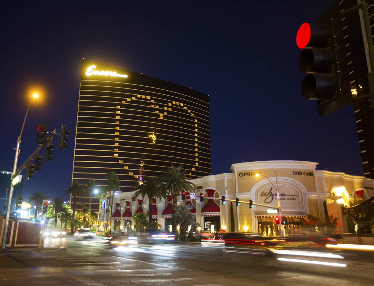 Traffic on the Strip passes by signage on Encore showing support for Las Vegas during the coron ...