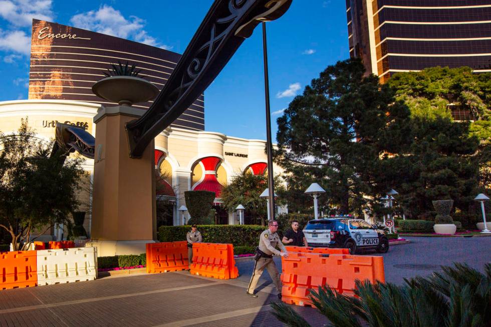 Las Vegas police and security officers at Wynn Las Vegas move barricades out front of the resor ...