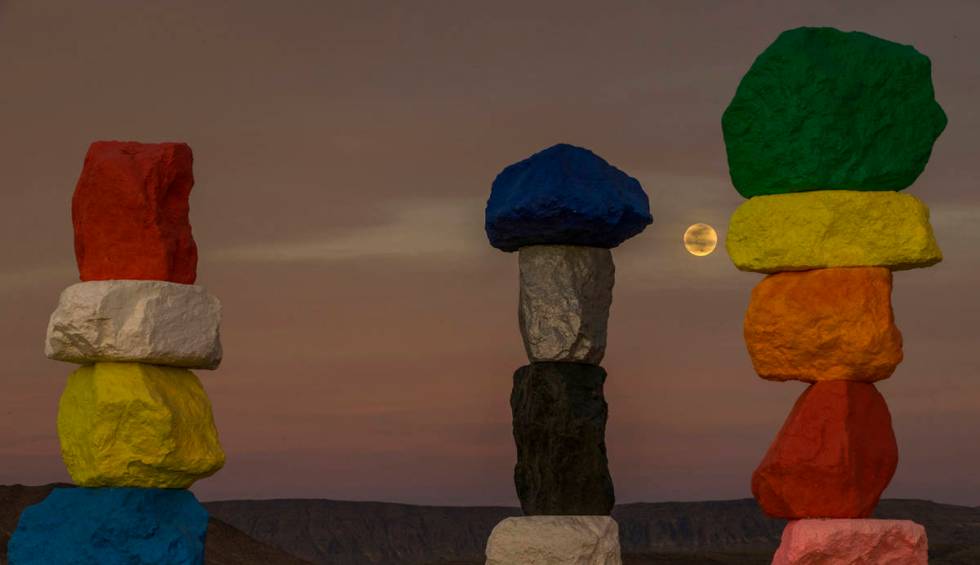The moon rises over the Seven Magic Mountains outside Las Vegas on May 6, 2020.  The full moon ...