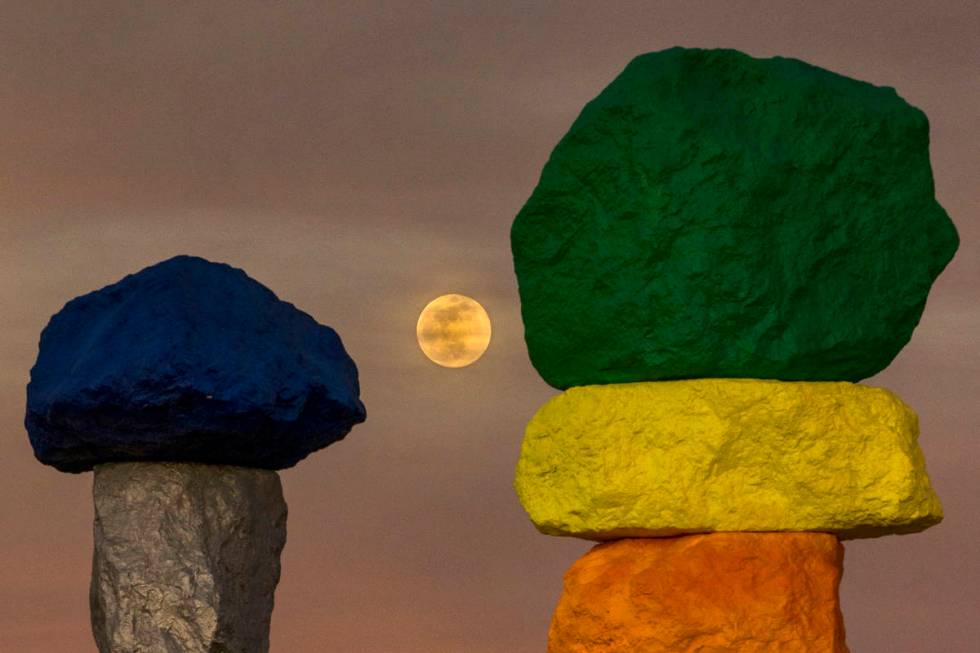 The moon rises over the Seven Magic Mountains outside Las Vegas on May 6, 2020.  The full ...