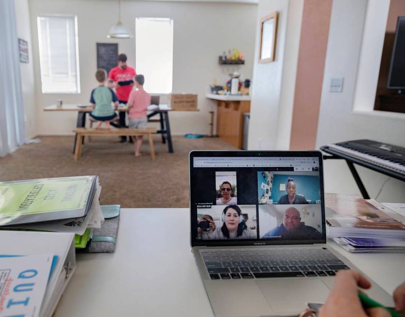 School counselor for Jerome Mack Middle School Jessica Houchins is in a work zoom meeting while ...