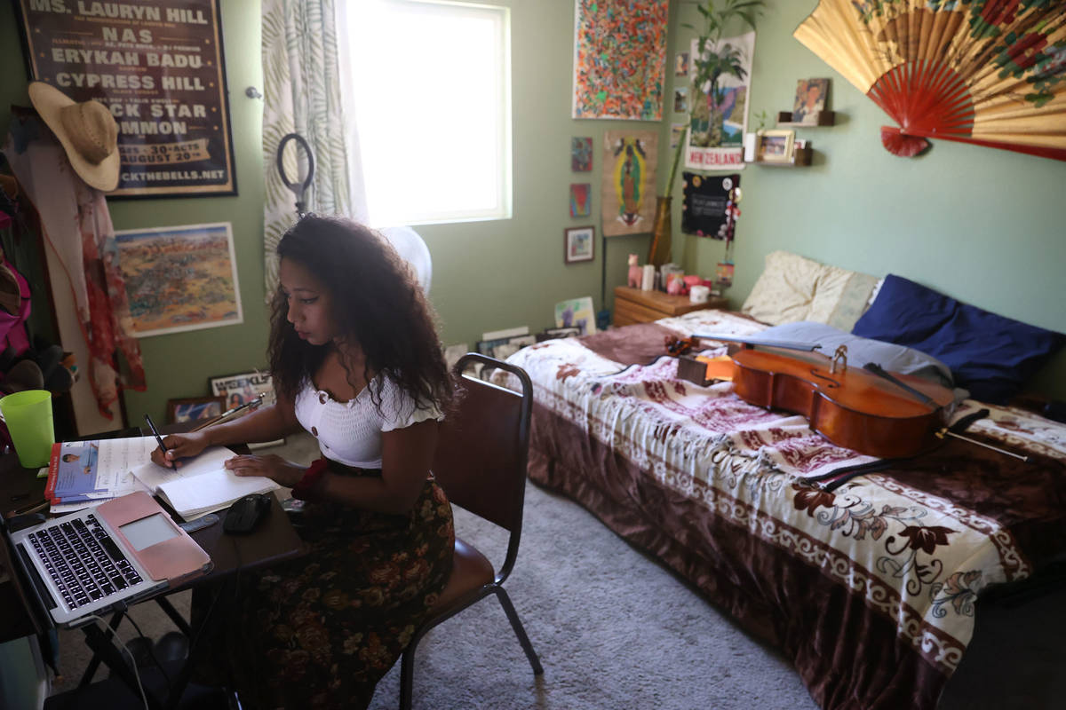 Orchestra teacher Coco Jenkins Thomas teaches students from her home in Las Vegas, Thursday, Ma ...