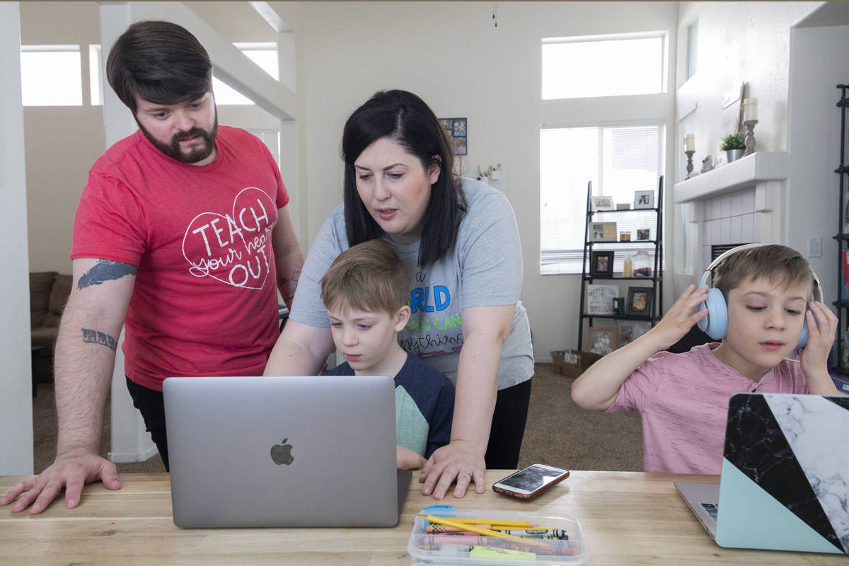 Christopher Houchins, a kindergarten teacher, left, and Jessica Houchins, a middle school coun ...