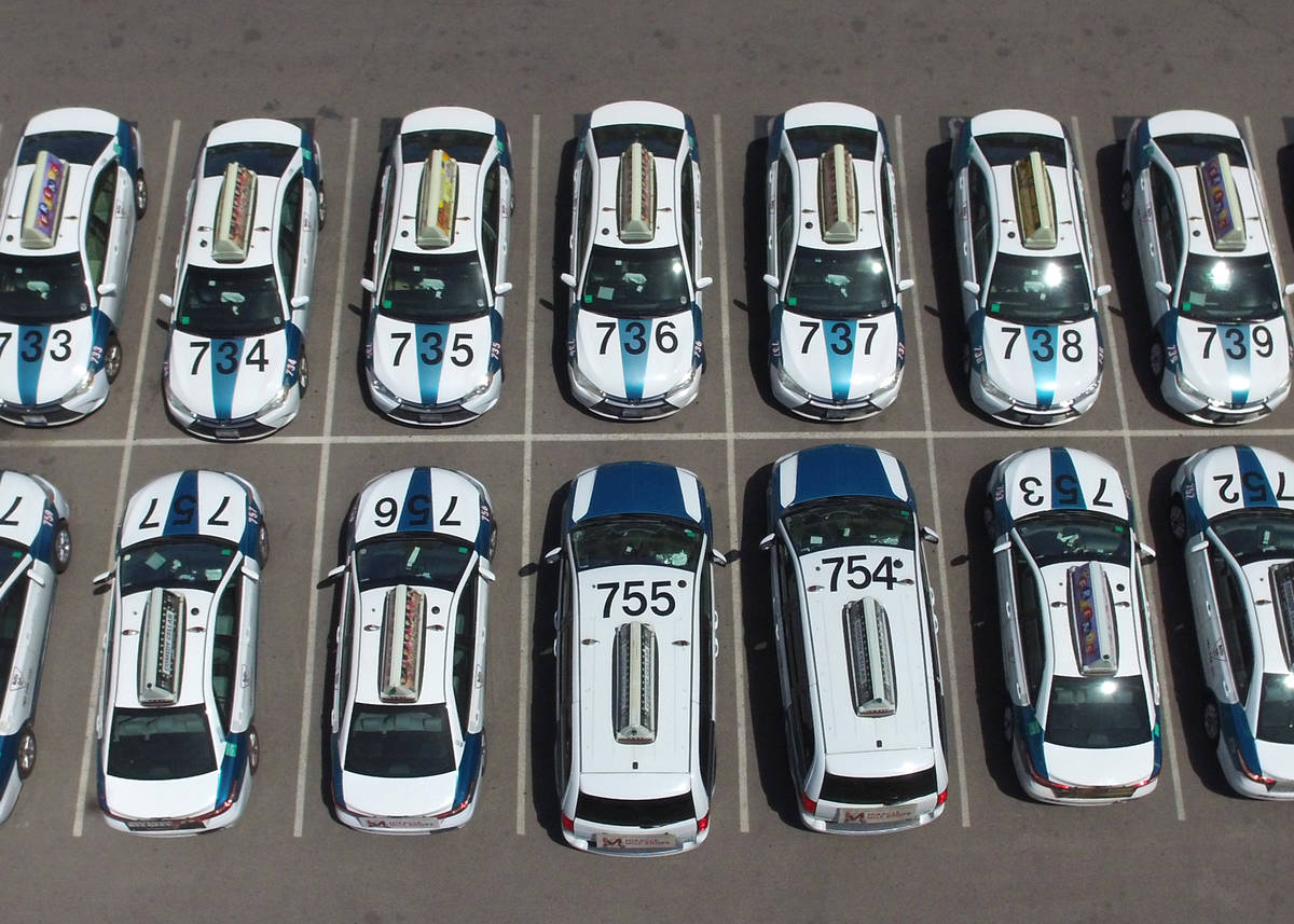 Taxis sit in a parking lot of Nellis Cab Company on Thursday, May 7, 2020, in Las Vegas. Taxi r ...