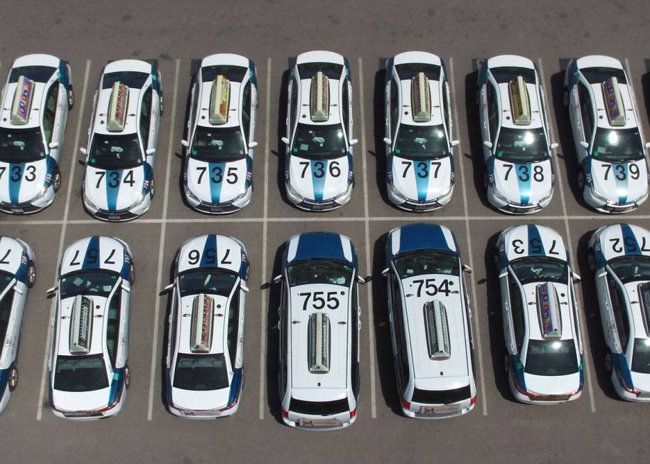 Taxis sit in a parking lot of Nellis Cab Company on Thursday, May 7, 2020, in Las Vegas. Taxi r ...