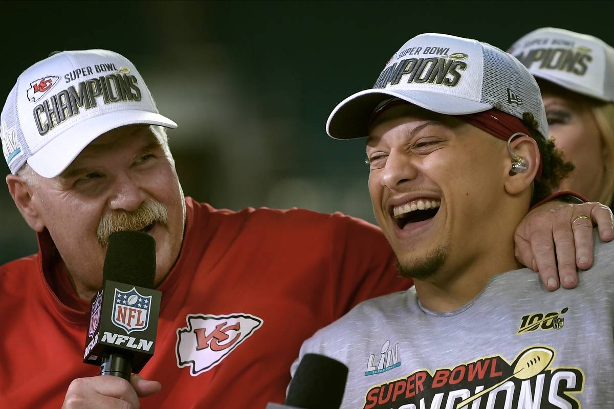 Kansas City Chiefs head coach Andy Reid, left, and quarterback Patrick Mahomes speak during a t ...