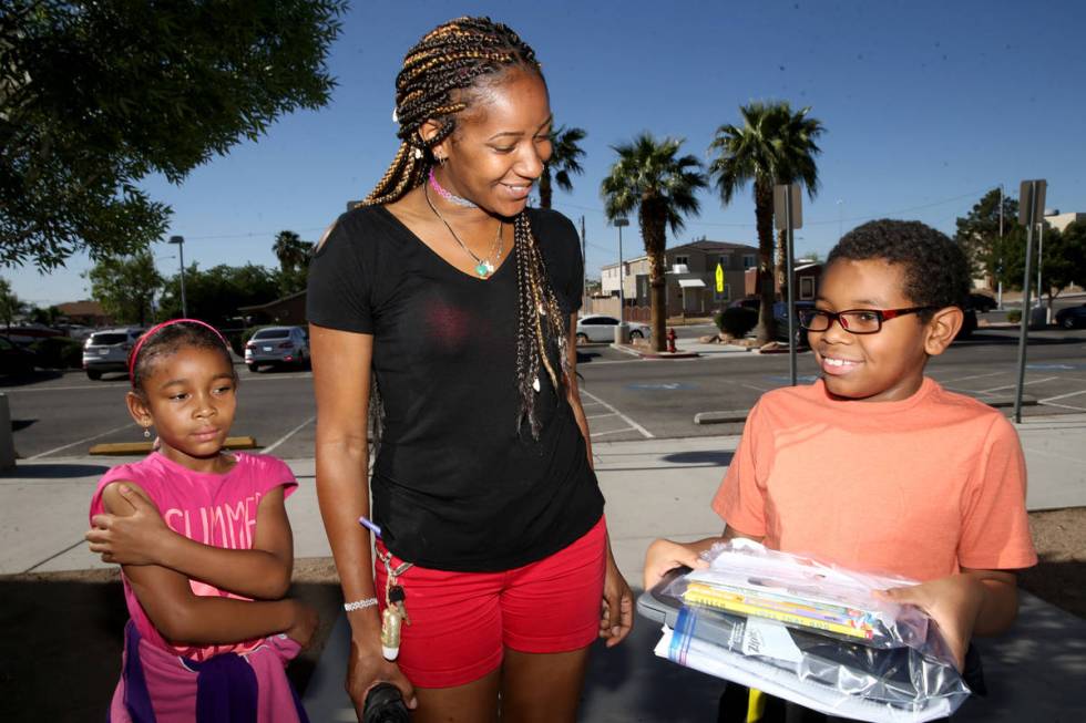 Jayden Jackson, 9, a third grader at Martinez Elementary, shows off his new Chromebook with his ...