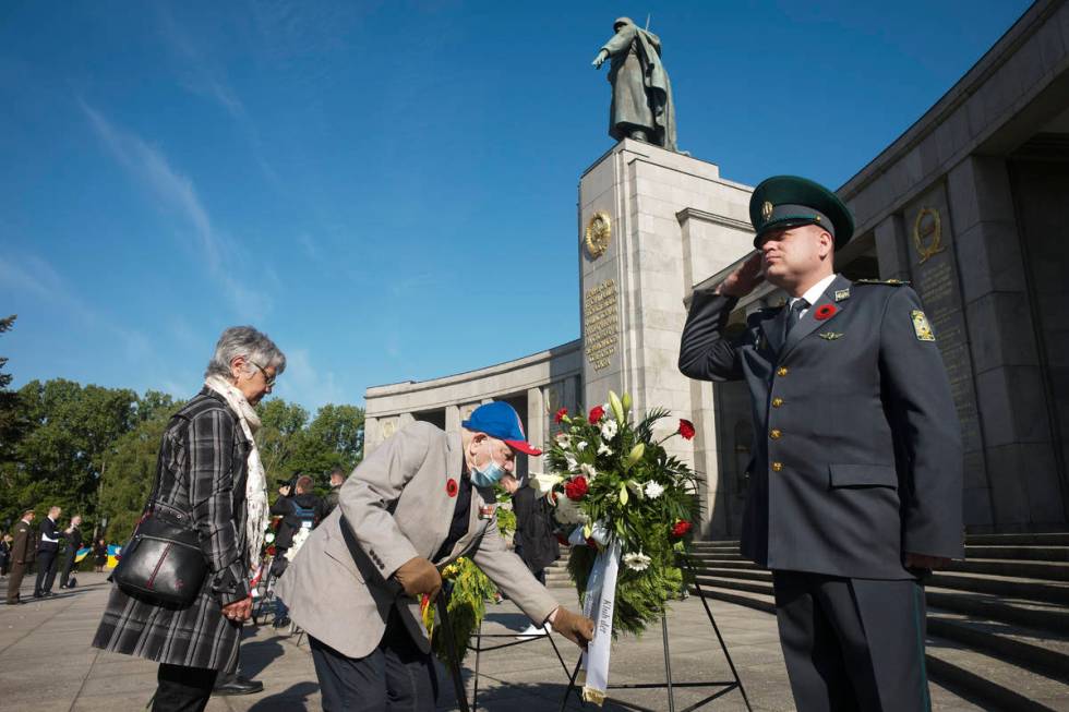 Red Army veteran Ukrainian Semen Kleinmann, centre, born 1926, attends a wreath laying ceremony ...