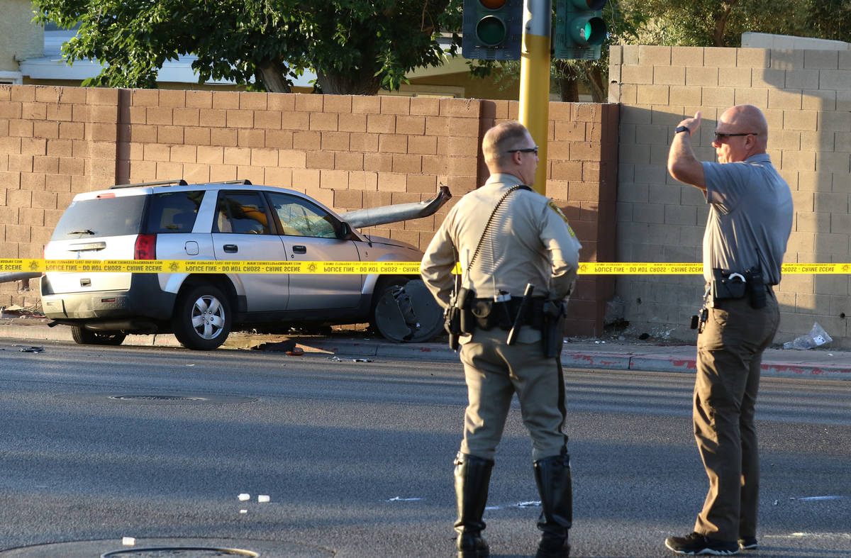 Las Vegas police investigate after a pedestrian was struck by a Saturn Vue SUV near South La Ca ...