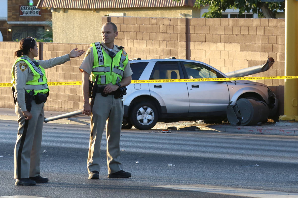 Las Vegas police investigate after a pedestrian was struck by a Saturn Vue SUV near South La Ca ...