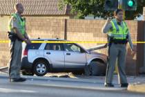 Las Vegas police investigate after a pedestrian was struck by a Saturn Vue SUV near South La Ca ...