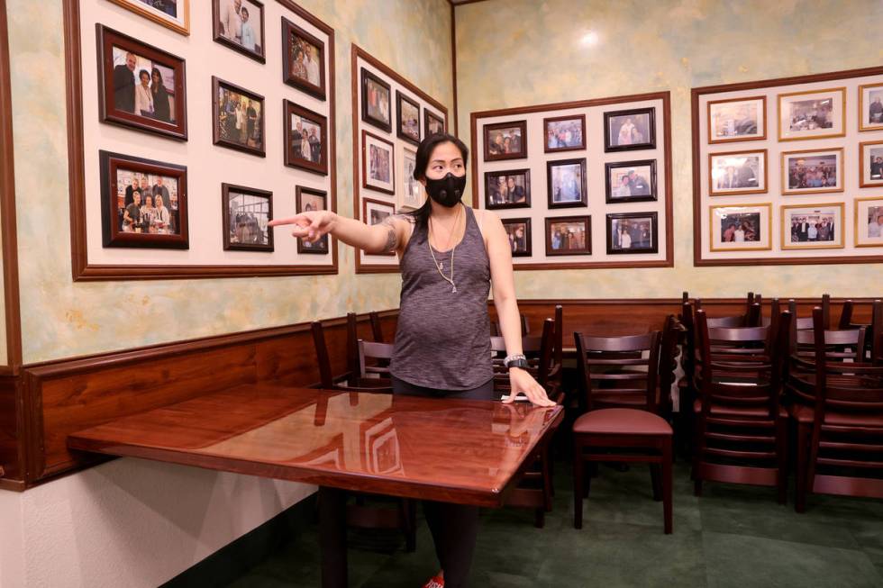 Penny Chutima, whose family owns Lotus of Siam, arranges tables six feet apart at the Las Vegas ...