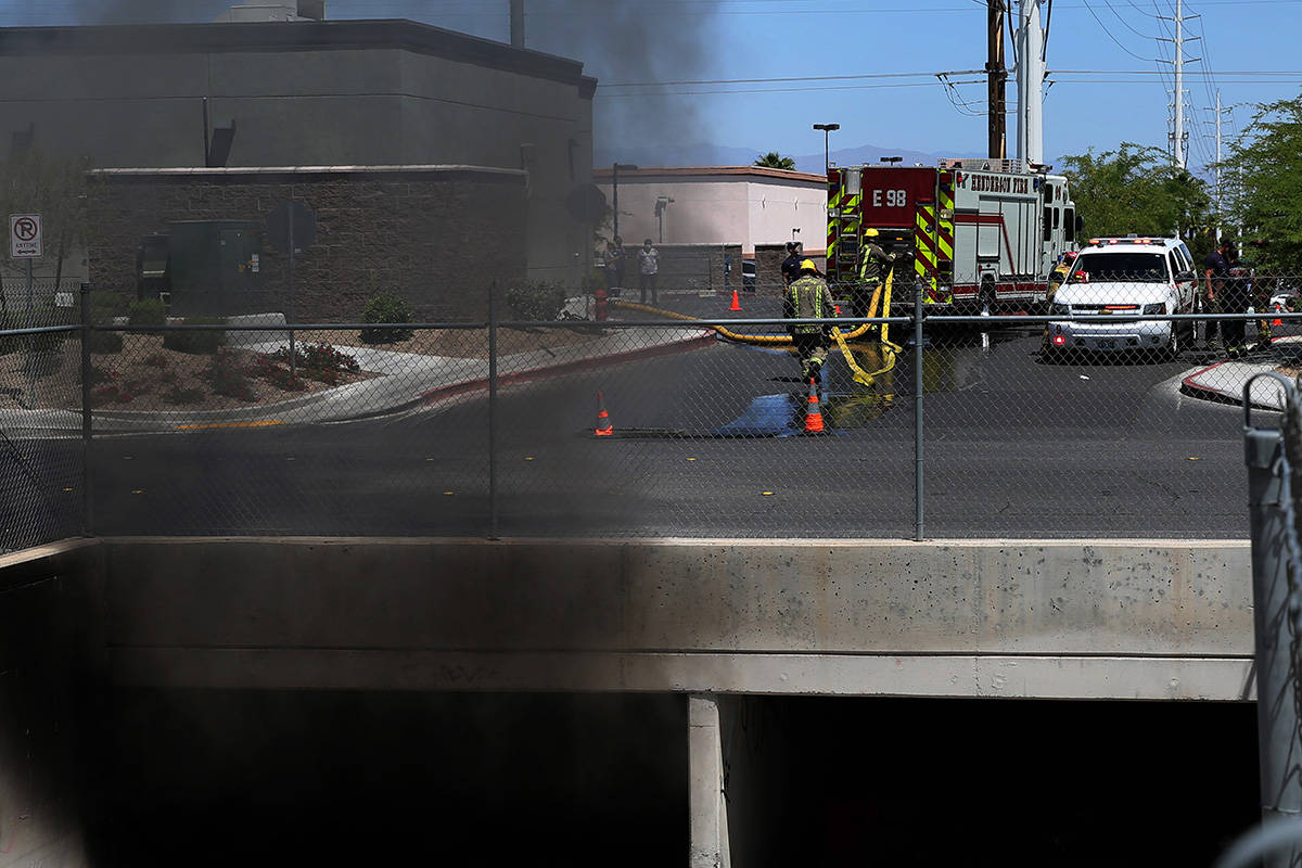 Henderson firefighters are investigating a fire in a storm drain that generated a large amount ...