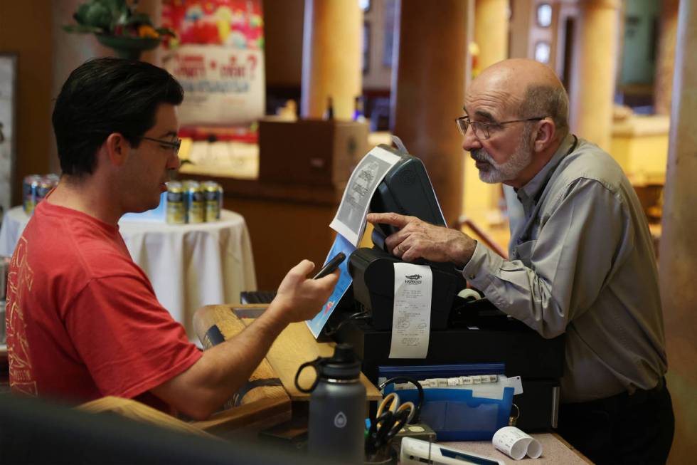 Mike O'Brien of Las Vegas, left, places an order with Bob Ansara, owner of Ricardo's Mexican Re ...