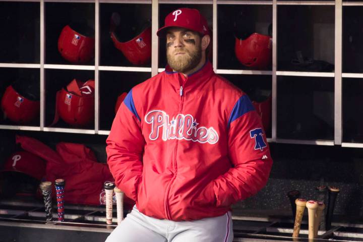 Philadelphia Phillies' Bryce Harper watches a video tribute from the dugout before a baseball g ...