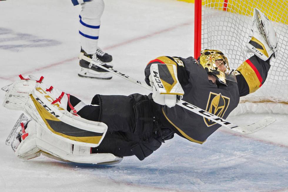 Vegas Golden Knights goaltender Marc-Andre Fleury (29) makes a diving save in the third period ...