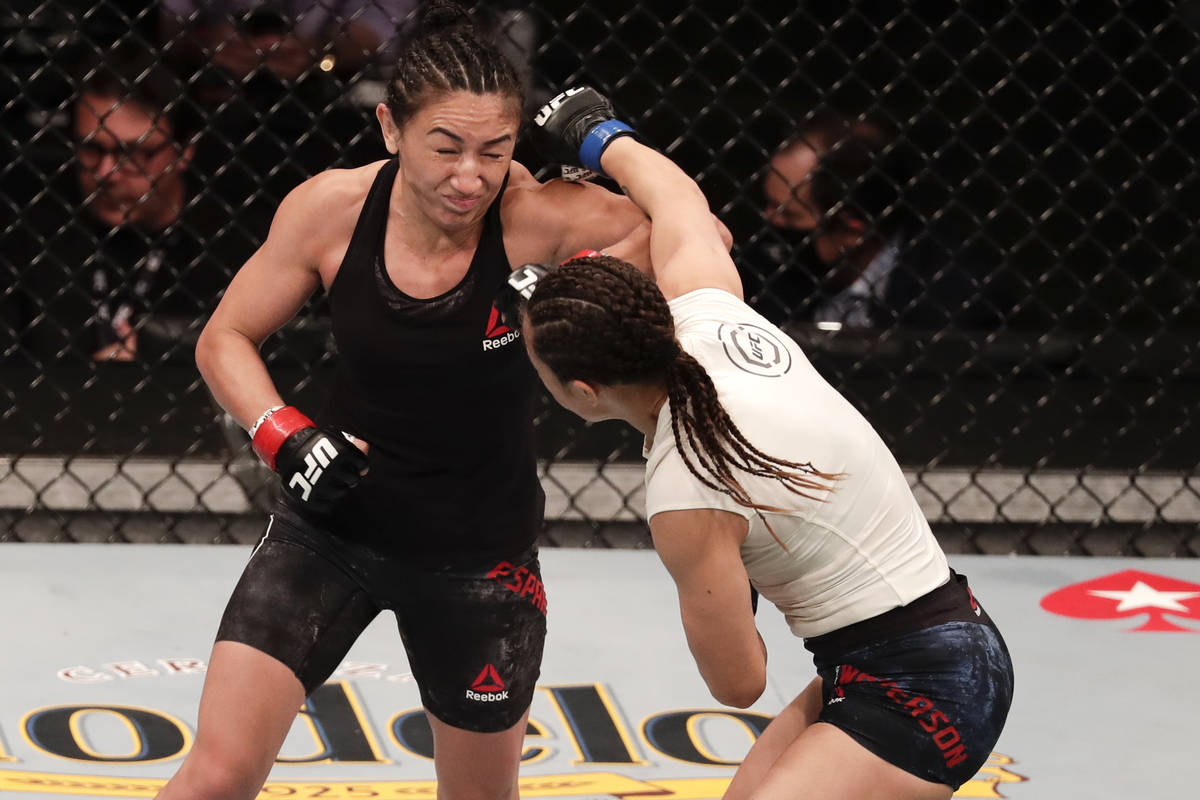 Carla Esparza, left, fights Michelle Waterson during a UFC 249 mixed martial arts bout Saturday ...