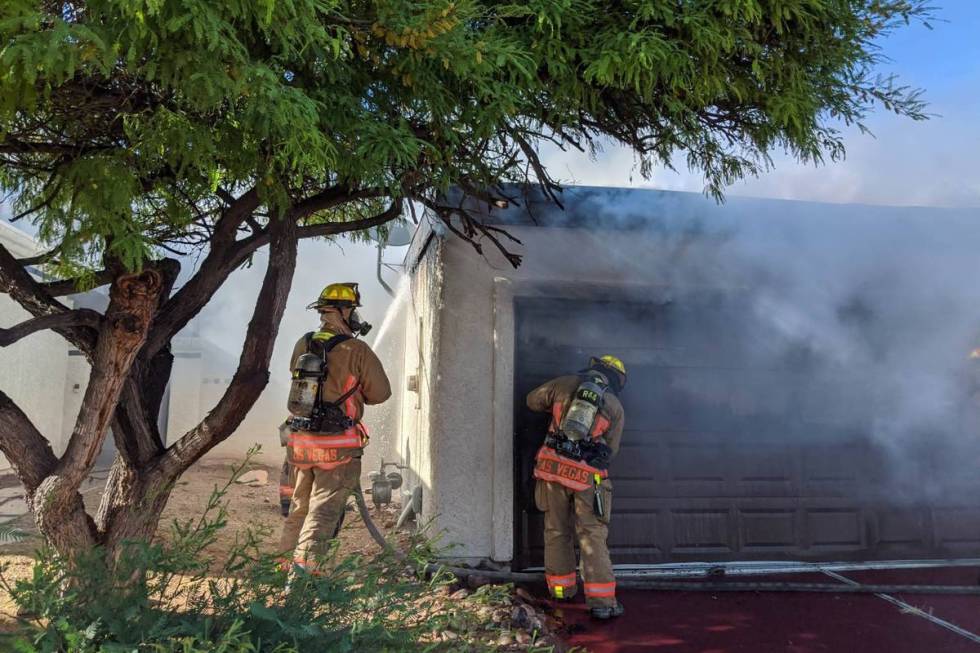Crews battle a fire Saturday, May 9, 2020, on the 7800 block of Sparkle Avenue in Las Vegas. (L ...