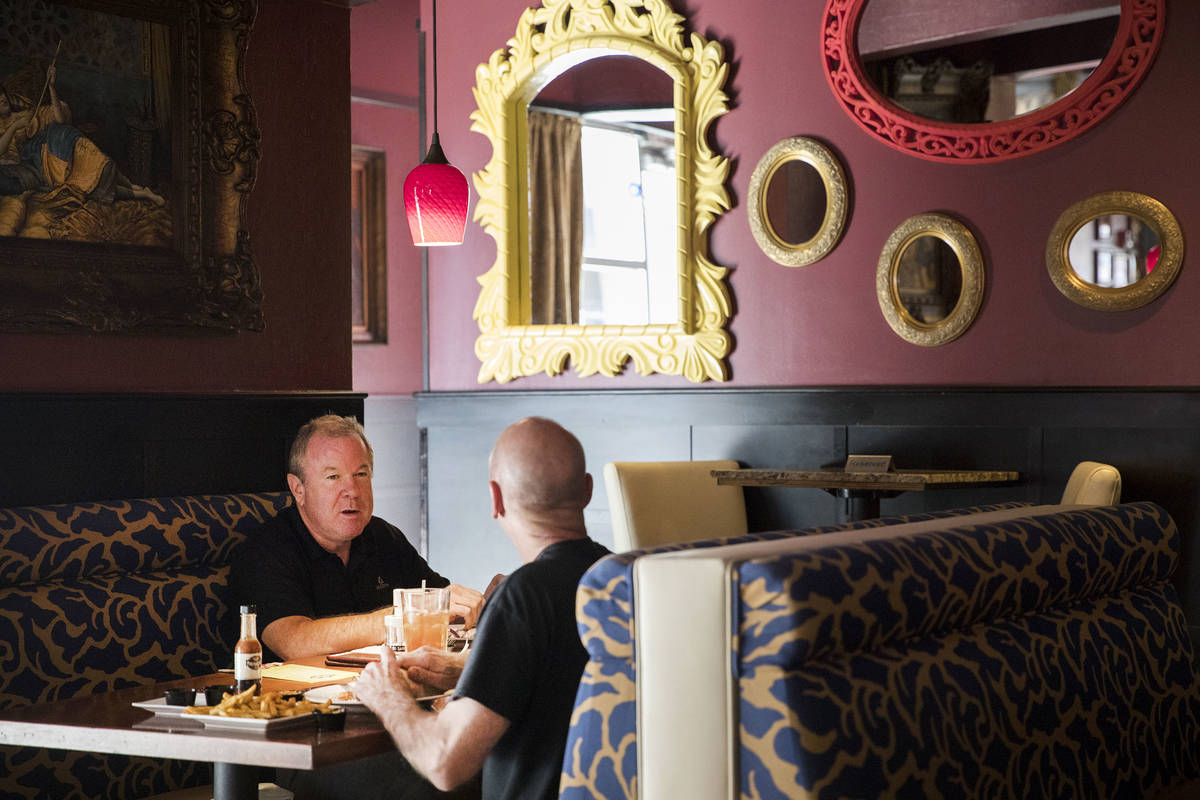 Andre Nelms, left, has lunch with Joe Giordano, right, at Paymons, a Mediterranean restaurant, ...