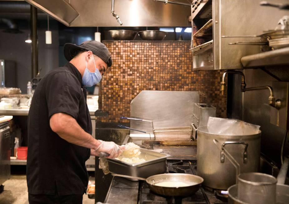 Jose Lopez works in the kitchen at 7th & Carson in Las Vegas, Sunday, May 10, 2020. Restaur ...