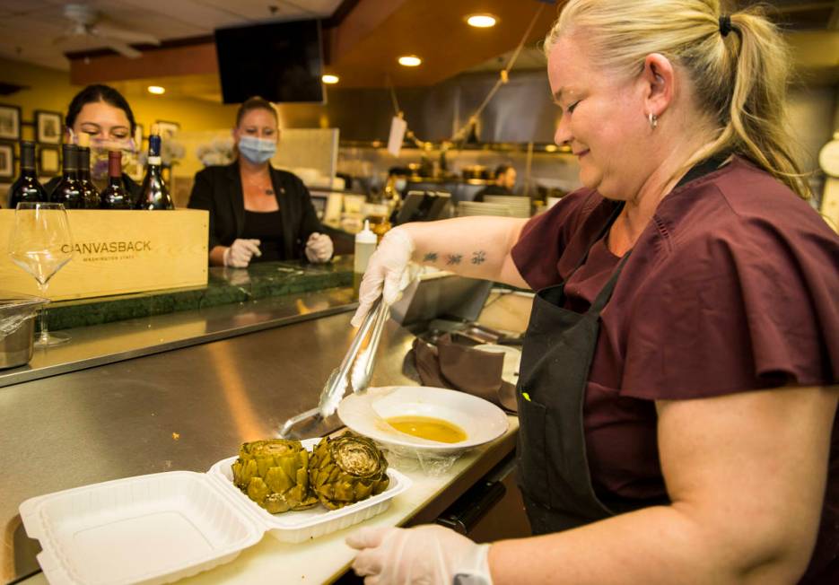 Brandi Thompson prepares some stuffed artichokes for a takeout order at D'Agostino's Trattoria ...