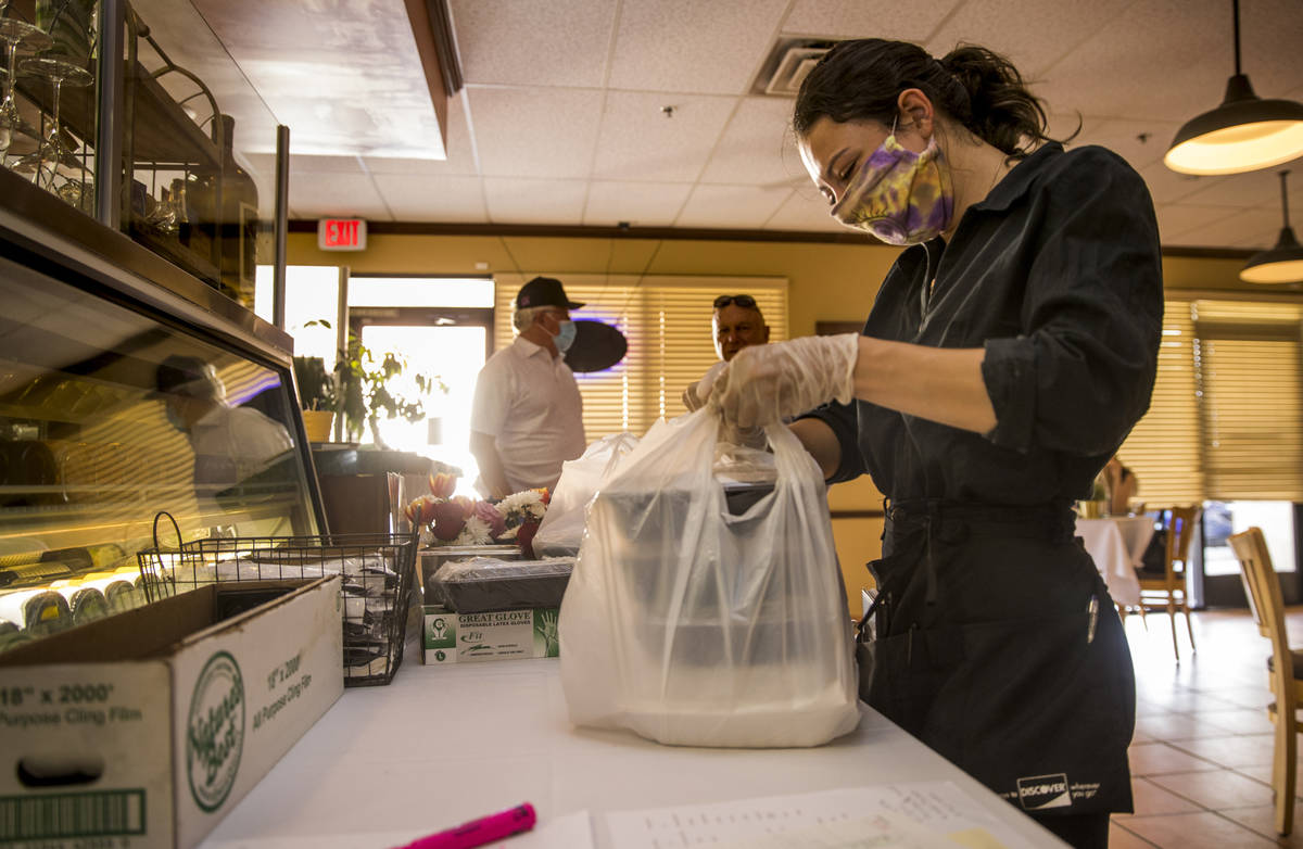 ServerCaroline Passaretti prepares another Mother's Day takeout dinner at D'Agostino's Trattori ...