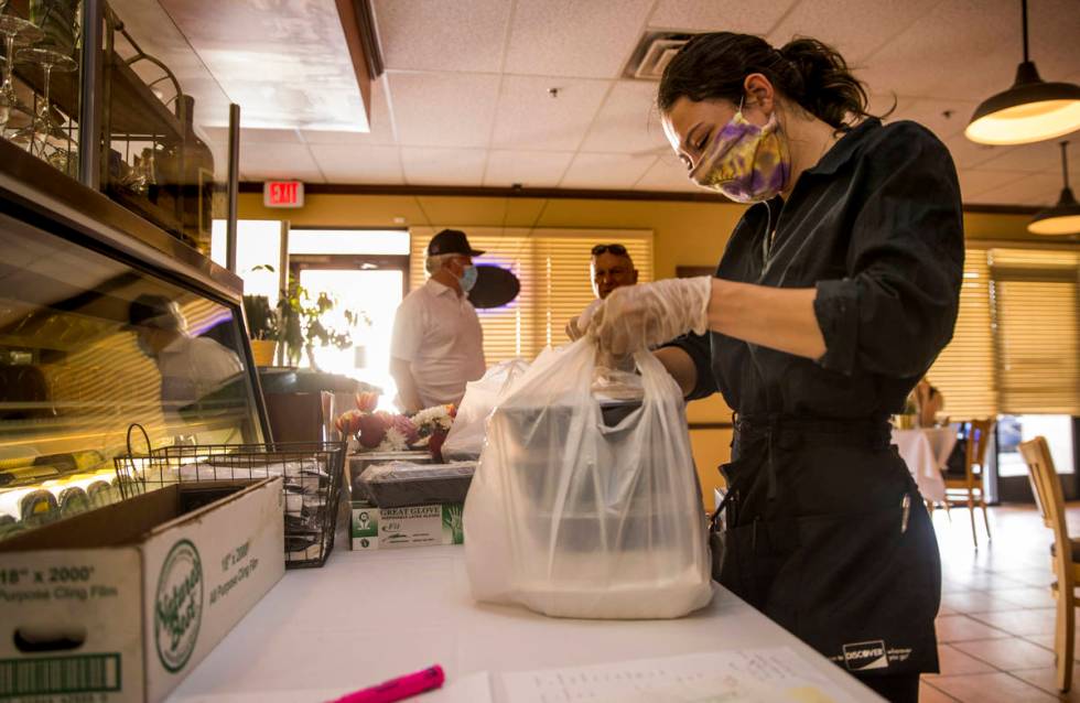 ServerCaroline Passaretti prepares another Mother's Day takeout dinner at D'Agostino's Trattori ...