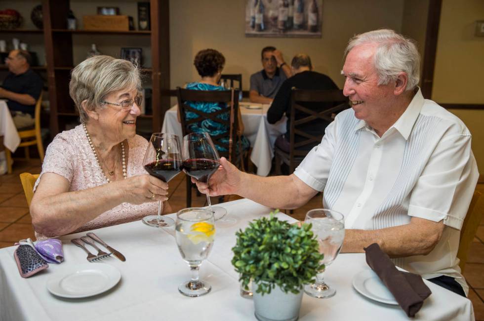 Peggy and Don Thompson share a toast a Mother's Day as they prepare to dine at D'Agostino's Tra ...