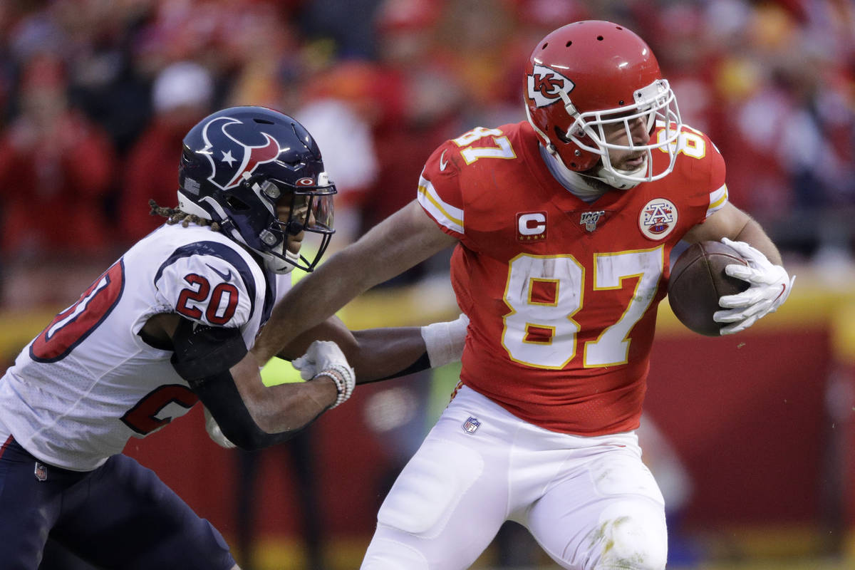 In this Jan. 12, 2020, file photo, Kansas City Chiefs tight end Travis Kelce (87) is tackled by ...