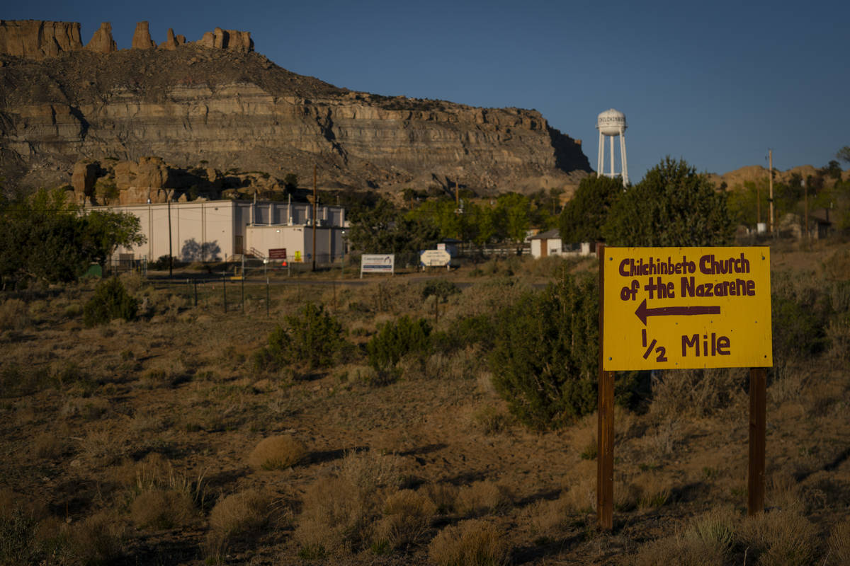 A hand-painted sign points the way to the Chilchinbeto Church of the Nazarene in Chilchinbeto, ...