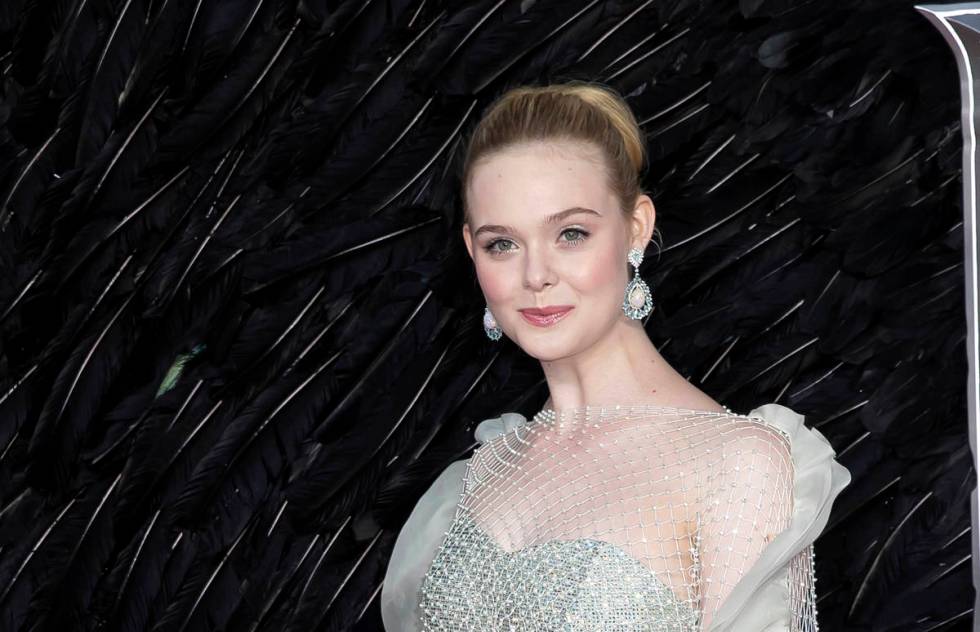 Actress Elle Fanning poses for photographers on arrival at the European Premiere of the film 'M ...