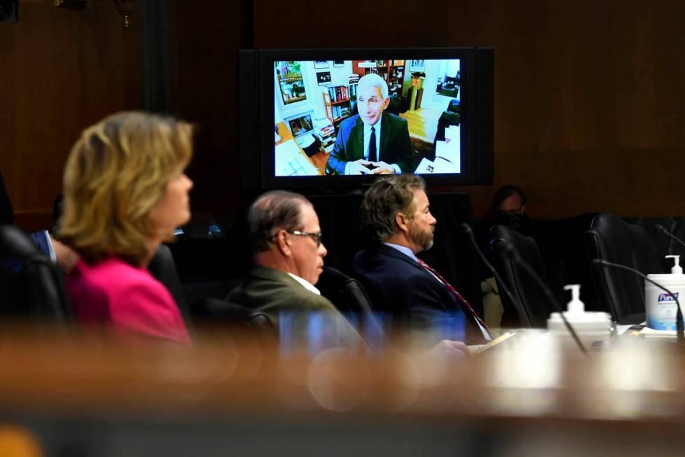 Senators listen as Dr. Anthony Fauci, director of the National Institute of Allergy and Infecti ...