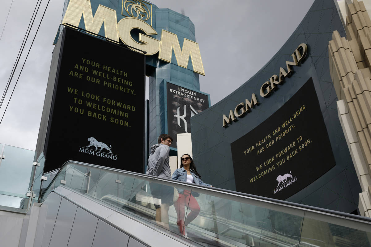 The MGM Grand hotel-casino, which is closing, flashes messages on their marquees that read "You ...