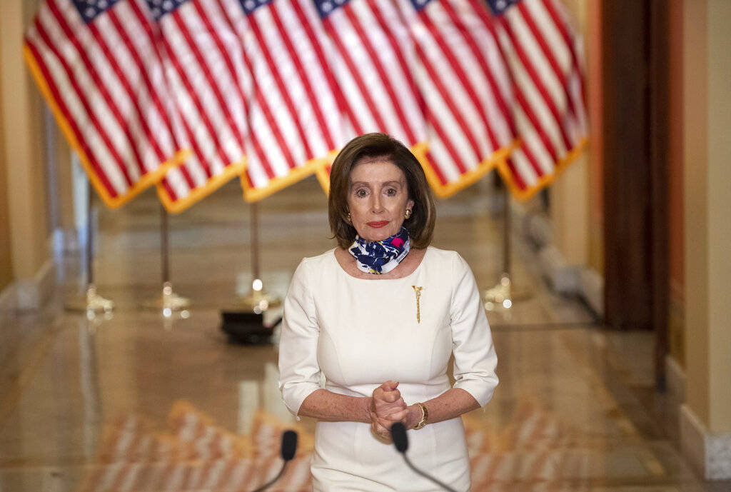 House Speaker Nancy Pelosi of Calif., walks to speak about the so-called Heroes Act, Tuesday, M ...