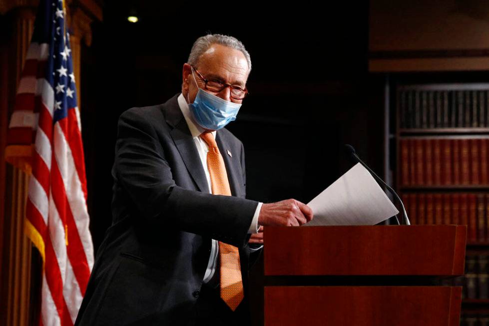 Senate Minority Leader Sen. Chuck Schumer of N.Y., center, arrives for a news conference on Cap ...