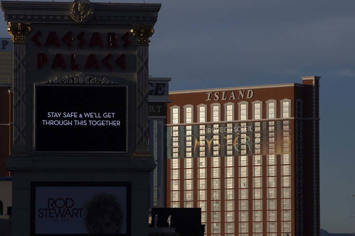 The sun sets on the Strip, including Caesars Palace and Treasure Island on Tuesday, March 24, 2 ...