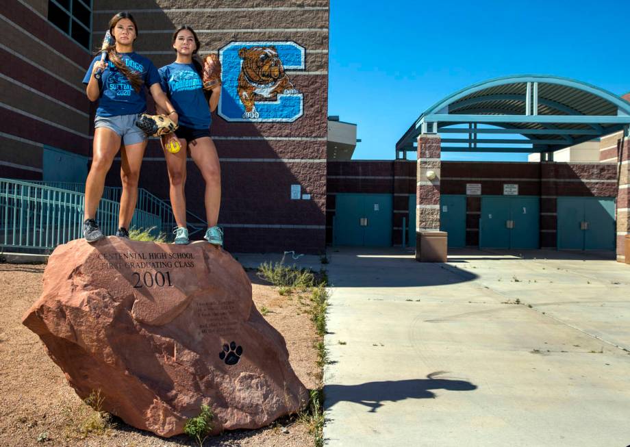 Samantha, left, and Natasha Lawrence as seniors from the Centennial High School softball team w ...