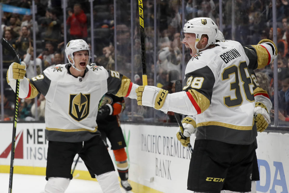 Vegas Golden Knights center Patrick Brown, right, celebrates with defenseman Nick Holden, left, ...