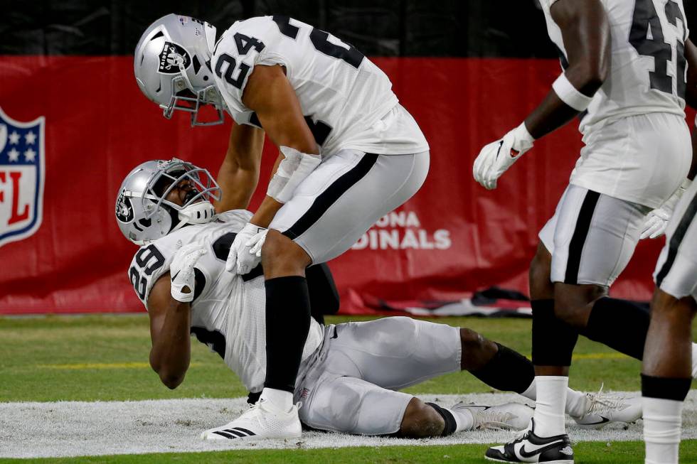 Oakland Raiders free safety Lamarcus Joyner (29) celebrates his safety with defensive back John ...