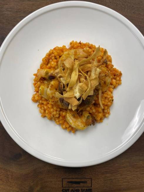 Pan-seared shrimp with Israeli couscous and yellow tomato puttanesca. (Cut and Taste)