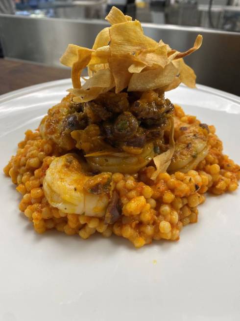 Pan-seared shrimp with Israeli couscous and yellow tomato puttanesca. (Cut and Taste)