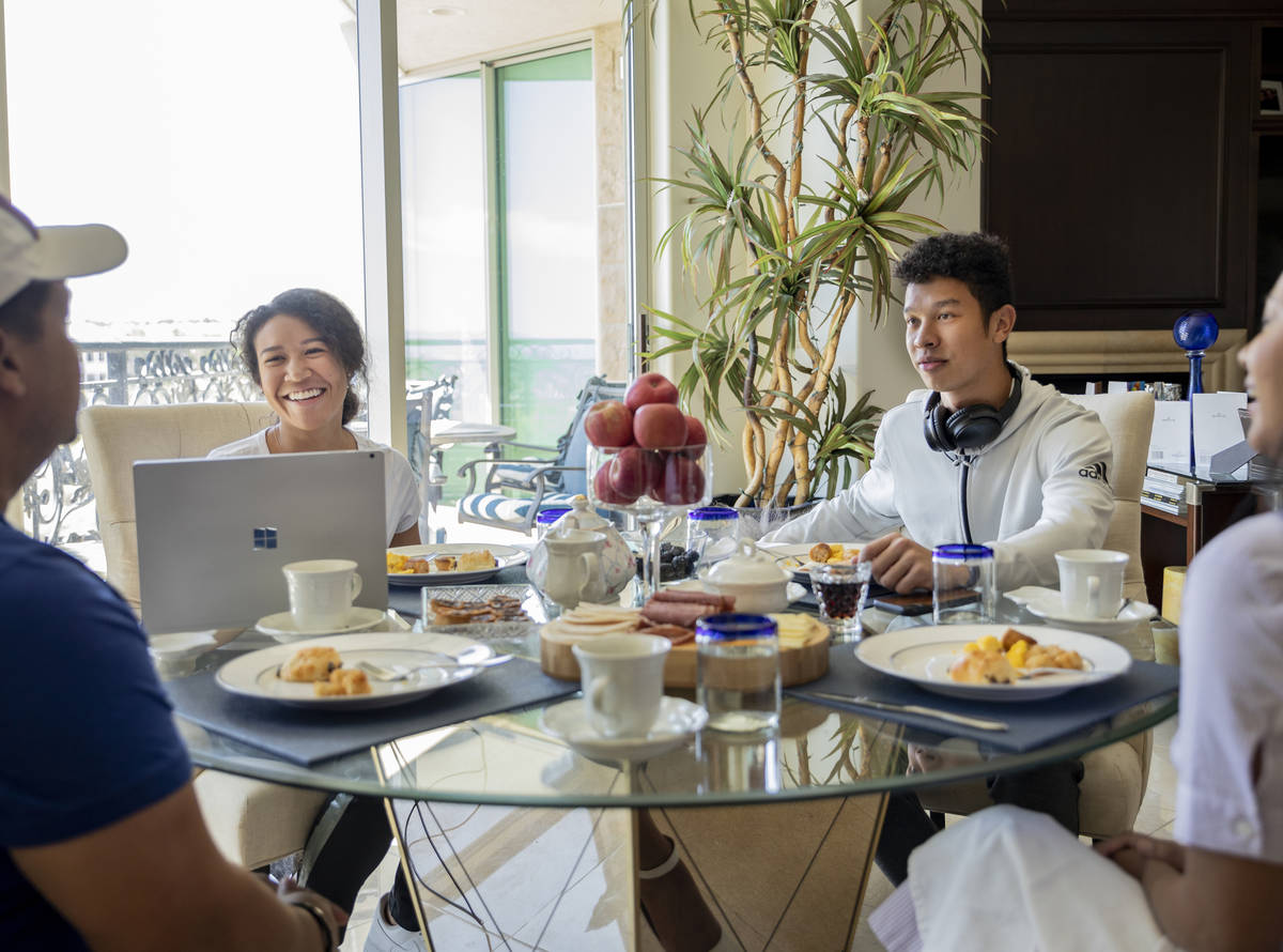 Siblings Amber Williams, left, and Lucas, eat brunch with their father Michael Williams and ste ...