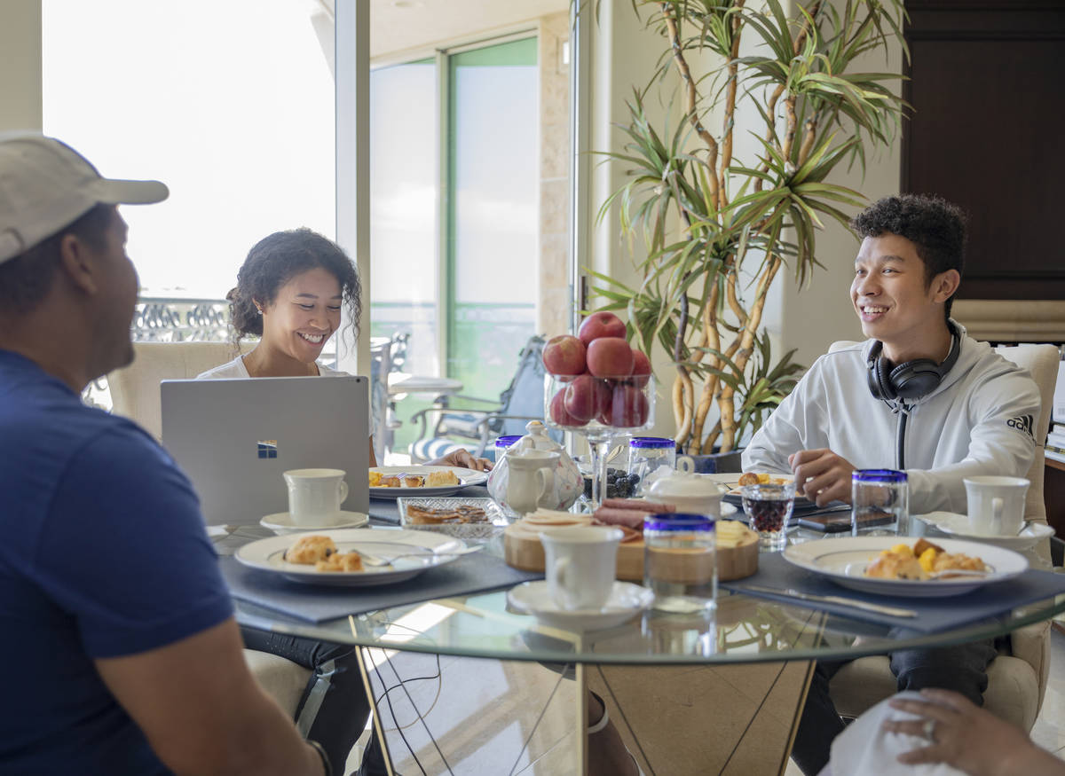 Siblings Amber Williams, left, and Lucas, eat brunch with their father Michael Williams and ste ...