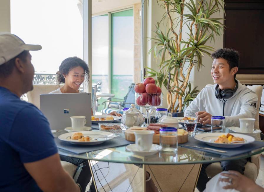 Siblings Amber Williams, left, and Lucas, eat brunch with their father Michael Williams and ste ...