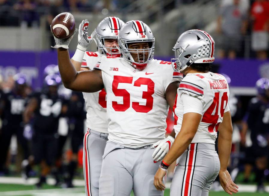 Ohio State defensive tackle Davon Hamilton (53) celebrates his fumble recovery for a touchdown ...