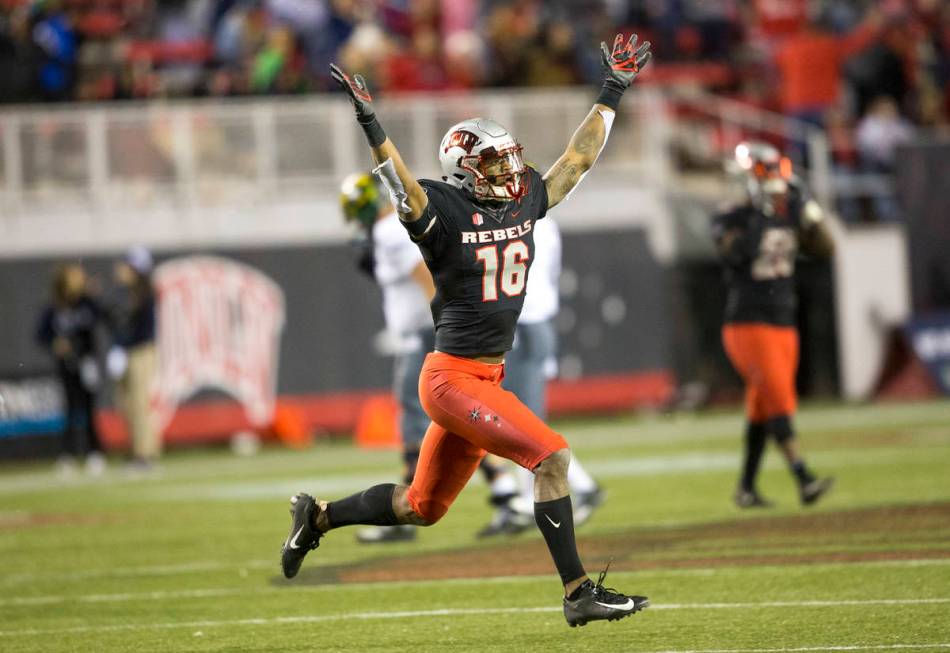 UNLV Rebels linebacker Javin White (16) celebrates his interceptions against the Nevada Wolf Pa ...