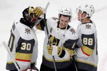 Vegas Golden Knights goalie Malcolm Subban, left, celebrates with defensemen Colin Miller, cent ...