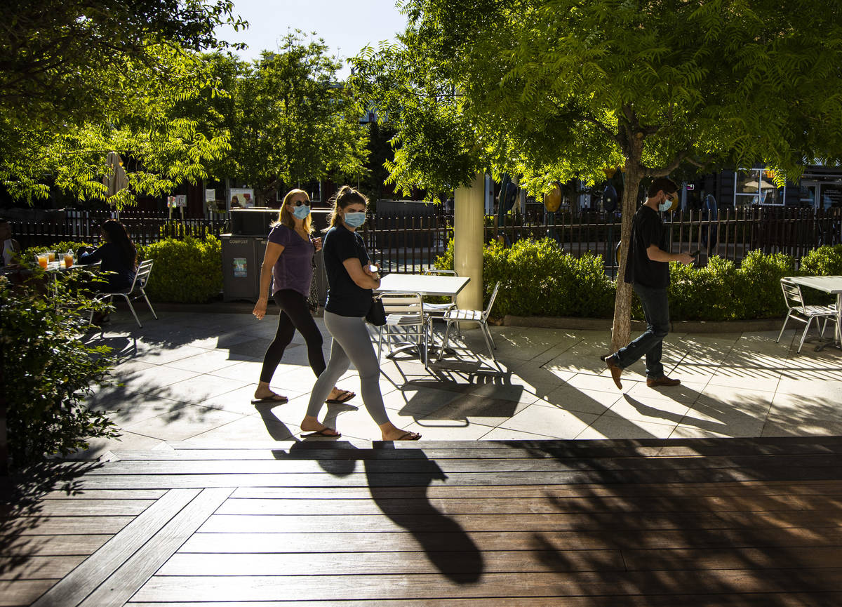 People walk around the Downtown Container Park on the first day of its reopening in downtown La ...