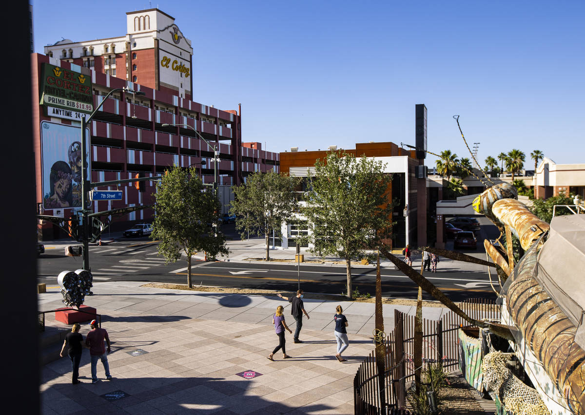 People walk outside of the Downtown Container Park on the first day of its reopening in downtow ...